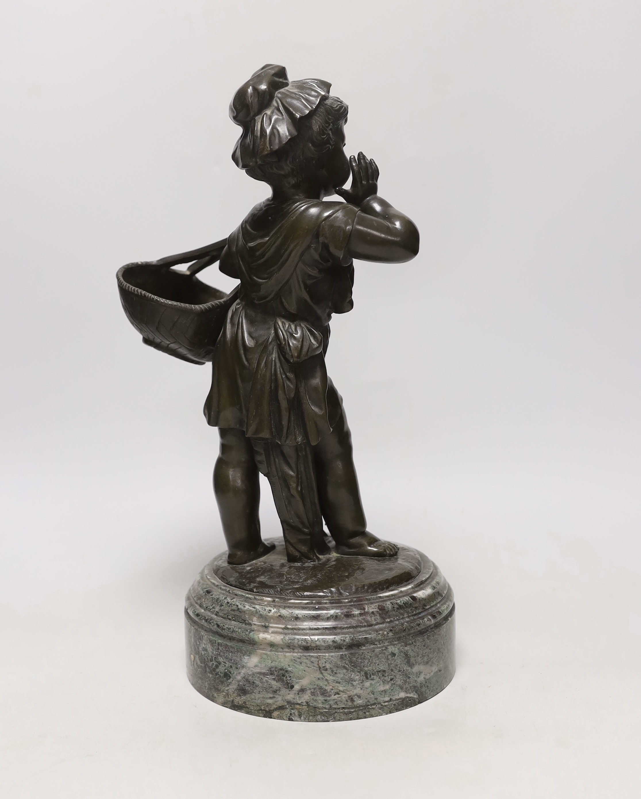 A 19th century bronze figure of a female seller on marble base, 37cm tall